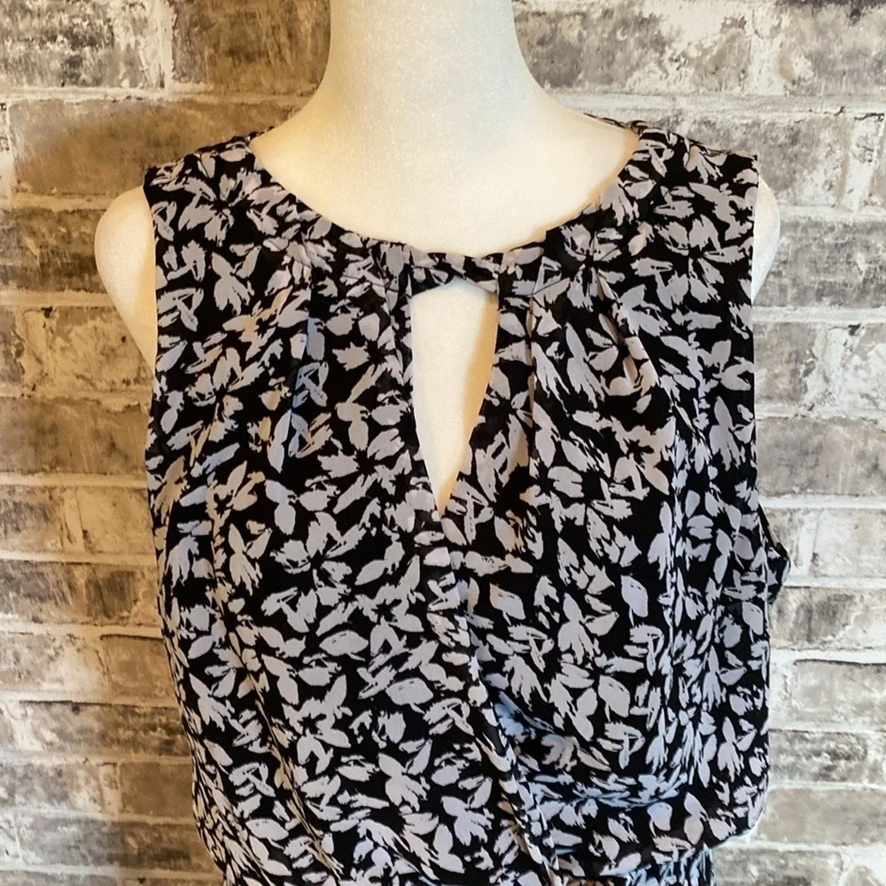 Karin Steven’s sleeveless black/white patterned lined dress. Tie at neck & waist